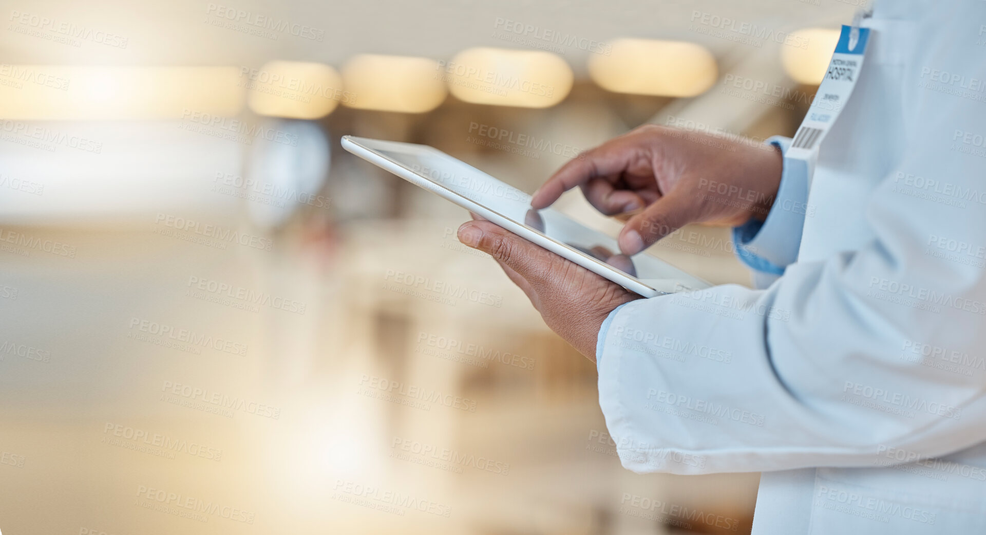 Buy stock photo Digital tablet, closeup and hands of a doctor browsing while doing medical research for a diagnosis. Healthcare, technology and professional male surgeon analyzing medicare data in hospital or clinic