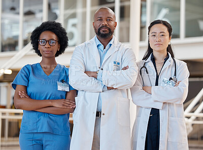 Buy stock photo Portrait, serious and team of doctors with arms crossed in hospital, healthcare support and clinic services. Diversity, group and confident medical employees ready for surgery collaboration together
