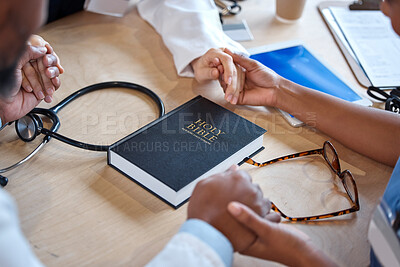 Buy stock photo Hands, bible and a healthcare team praying for a miracle curing a meeting in a hospital office together. Medical, trust or teamwork with doctors and nurses asking God or Jesus for help in a clinic