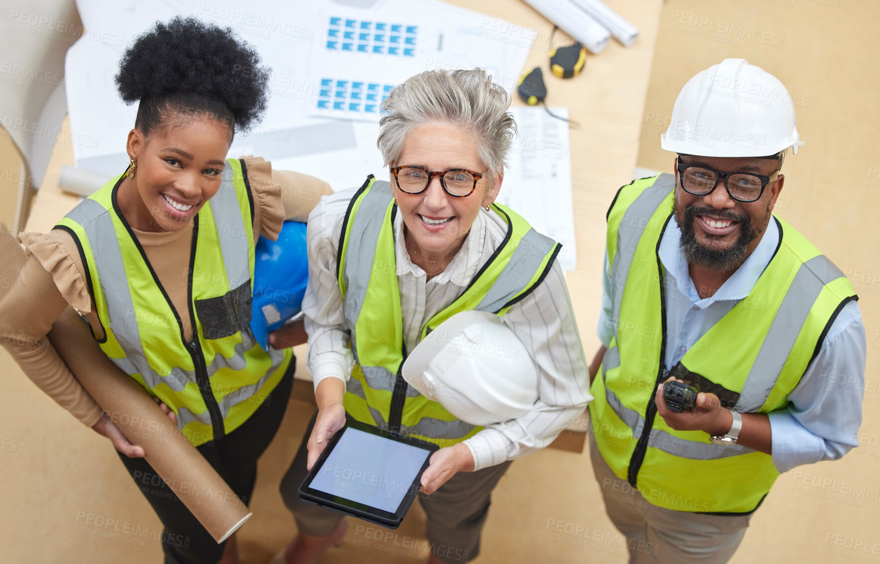 Buy stock photo Tablet, teamwork or portrait of engineers with manager planning a construction for architecture. Top view, blueprint or happy black people with mature woman meeting together on a development project