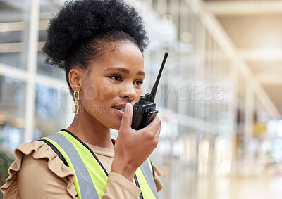 Buy stock photo Walkie talkie, black woman and engineer talking for communication, construction and listening. African architect, radio and contractor planning industrial project, building maintenance and logistics.