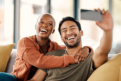 Buy stock photo Home, selfie and couple on a couch, smile and loving together with romance, profile picture and marriage. Social media, black woman or Asian man on a sofa, romantic and memory with happiness or relax