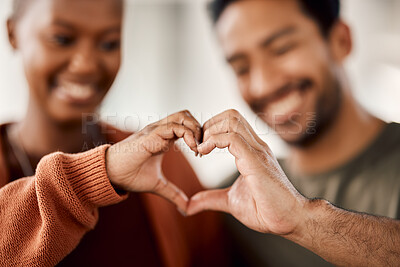 Buy stock photo Love, heart and happy with hands of couple for solidarity, romance and support. Kindness, happiness and relationship with closeup of man and woman with emoji shape at home for care, date and marriage