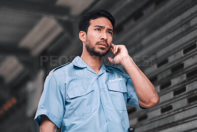 Buy stock photo Security guard, serious and safety officer man on the street for protection, patrol or watch. Law enforcement, focus and duty with a crime prevention male worker in uniform to listen communication