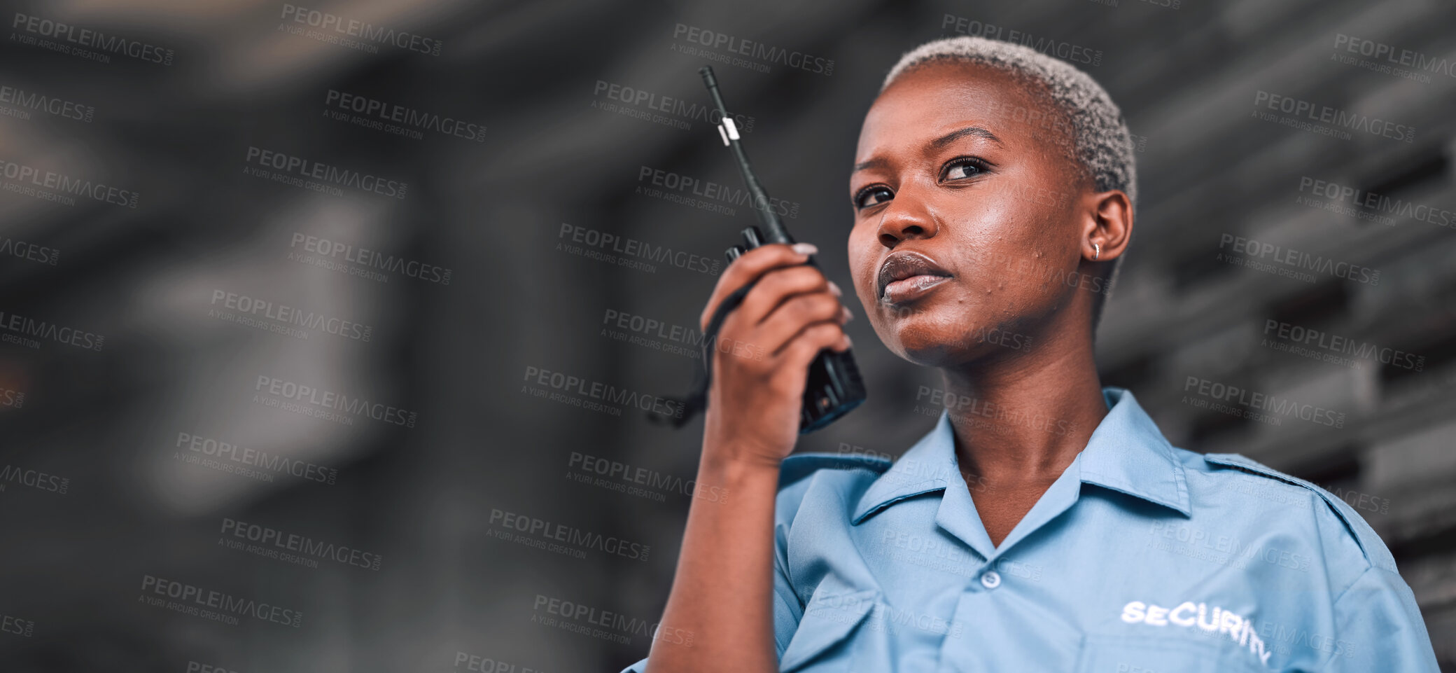 Buy stock photo Security, radio and a black woman police officer in the city during her patrol for safety or law enforcement. Walkie talkie, communication and service with a female guard on a street in an urban town