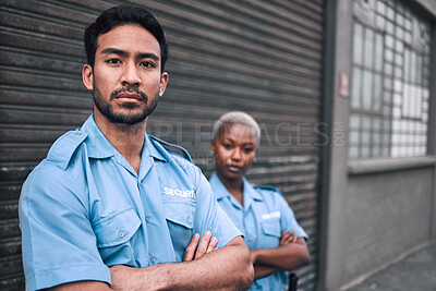 Buy stock photo Portrait, security or law enforcement and a serious man arms crossed with a black woman colleague on the street. Safety. focus and duty with a crime prevention unity working as a team in the city