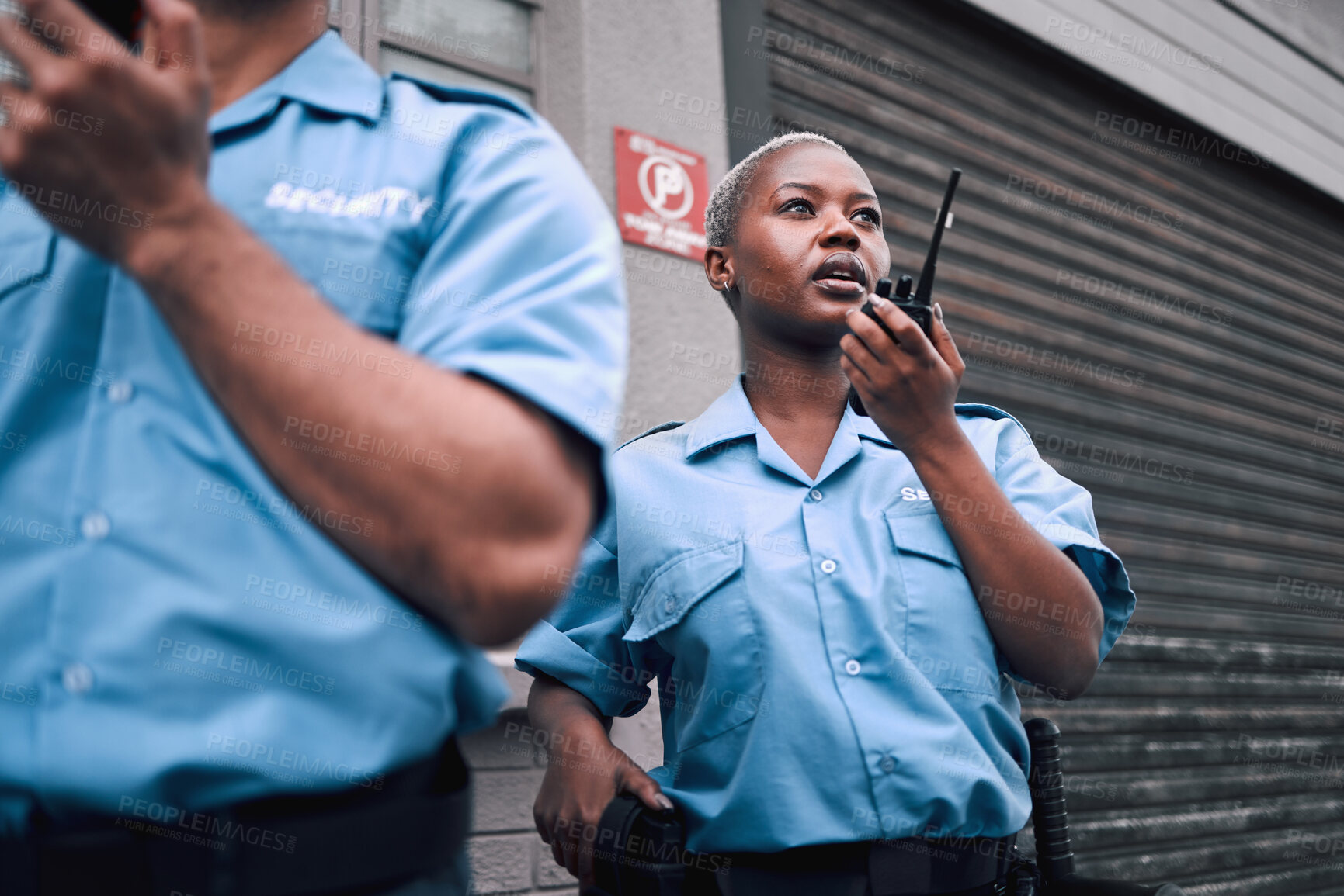 Buy stock photo Security, walkie talkie and a black woman police officer in the city during her patrol for safety or law enforcement. Radio, communication and service with a female guard on a street in an urban town