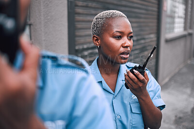 Buy stock photo Security, walkie talkie and a police woman in the city during her patrol for safety or law enforcement. Radio, communication and service with an african female guard on a street in an urban town