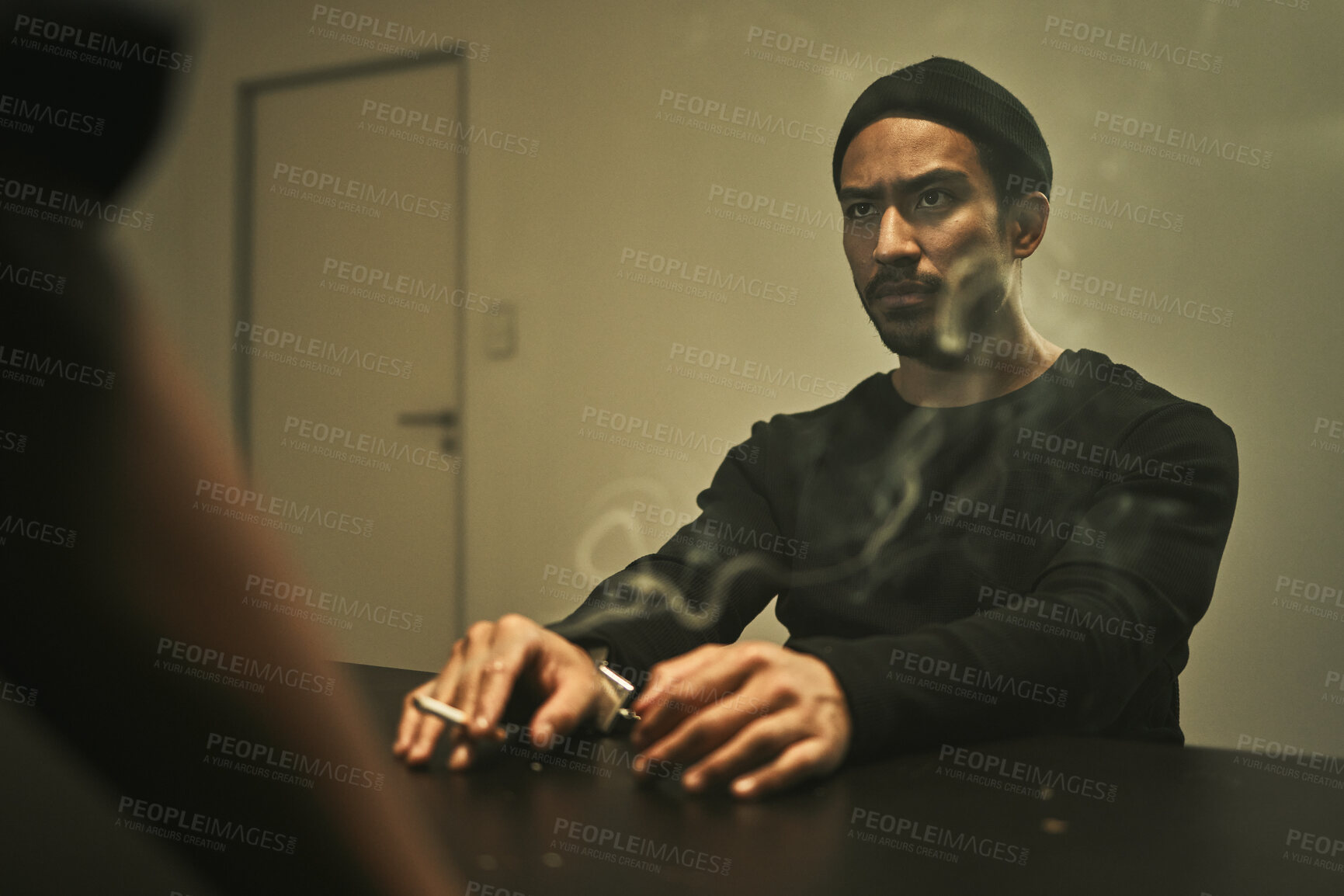 Buy stock photo Man in investigation, smoking and detective in interrogation room with criminal, suspect or interview with a gangster. Police officer, questioning and statement of truth and person with cigarette