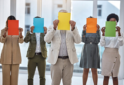 Buy stock photo Collaboration, paper and an anonymous business team standing in the office together to show selection options. Teamwork, mockup and color poster with a group of colleagues or employees at work