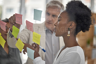 Buy stock photo Meeting, planning and glass with a black woman leading a presentation in a boardroom for company strategy. Teamwork, presentation and sticky notes in an office with a female employee talking to staff