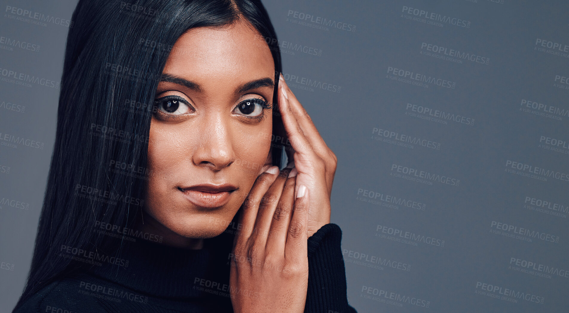 Buy stock photo Face, skincare touch and confidence of woman in studio isolated on a gray background mockup space. Serious portrait, natural beauty and cosmetics of Indian model with facial treatment for aesthetic.