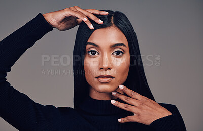 Buy stock photo Face, beauty and skincare of confident woman in studio isolated on a gray background. Serious portrait, natural and Indian model with spa facial treatment for aesthetic, healthy skin and cosmetics.
