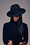 Fashion, woman in hat and beauty, dark and mystery with  glamour and luxury isolated on studio background. Designer clothes, black aesthetic and female model, vintage style with cosmetics and edgy