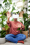 Hands, virtual reality and headset of a woman at home for metaverse, 3d world or interaction. Black person with plants and vr glasses for ecology, ai or touch for video game or online experience