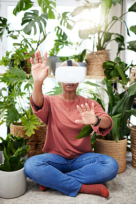 Buy stock photo Hands, virtual reality and headset of a woman at home for metaverse, 3d world or interaction. Black person with plants and vr glasses for ecology, ai or touch for video game or online experience