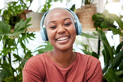 Buy stock photo Relax, music and portrait of black woman with plants in home for wellness, happiness and calm. Nature, headphones and face of female person listening to audio with ferns, leaves and house plant
