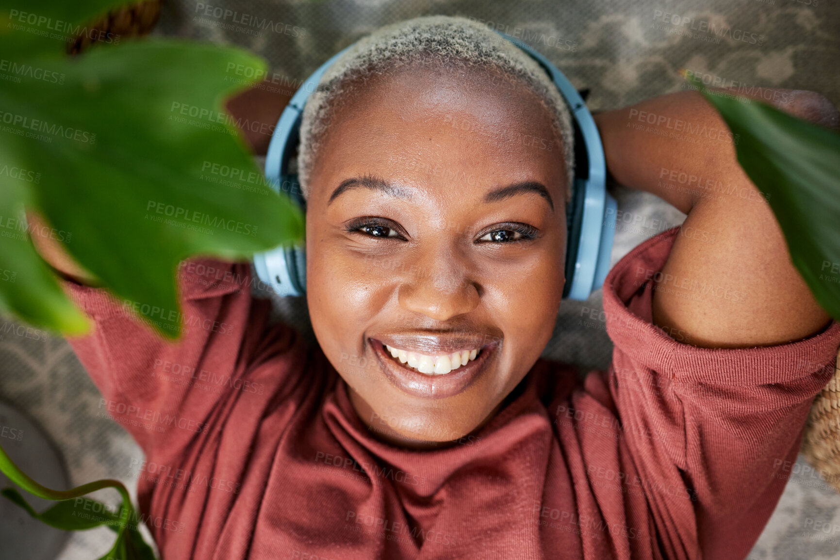 Buy stock photo Woman, portrait and headphones for listening to music to relax with plants for peace and calm. Face of a happy black female person streaming sound, audio and podcast or radio online at home