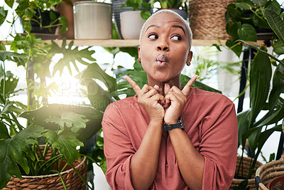 Buy stock photo Black woman, silly face and green house plant with comedy feeling happy feeling shy. African female person, girl and crazy with hand sign and funny pout with comic confidence and greenery with joke