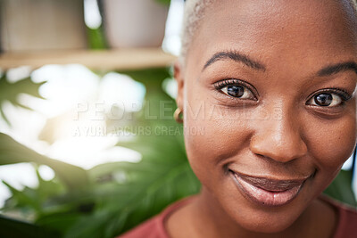 Buy stock photo Portrait, plants and flare with a black woman gardener in her home for sustainability or green growth. Face, beauty and smile with a happy young female person in a nursery for eco friendly gardening