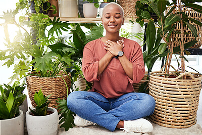 Buy stock photo Peace, breathe and calm woman by plants for meditation exercise in a greenery nursery. Health, gratitude and young African female person with a relaxing zen mindset by an indoor greenhouse garden.