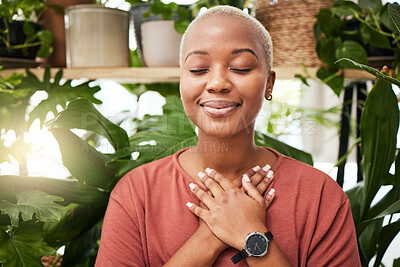 Buy stock photo Zen, breathing and calm woman by plants for breathing exercise in meditation in a nursery. Breathe, gratitude and young African female person with a relaxing mindset by an indoor greenhouse garden.