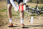 Injury, legs or man cycling with knee pain, cramp or inflammation in training, workout or exercise. Red glow, sports or injured athlete biker with a sprain after fall, accident or emergency on trail