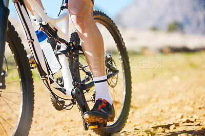 Buy stock photo Closeup, outdoor and biker with fitness, cycling and training for a competition, road and sneakers. Zoom, male person or cyclist with workout goal, nature or travel with performance athlete or sports