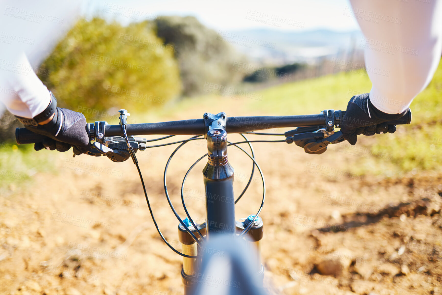 Buy stock photo Cycling, fitness and bike with hands of person in nature for training, sports or travel. Workout, exercise and wellness with closeup of cyclist and handlebar of bicycle on path for energy and freedom