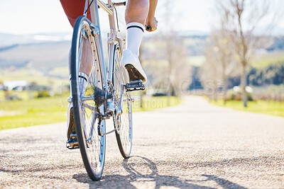 Buy stock photo Closeup, outdoor or cyclist with fitness, bicycle or training with sneakers, health or wellness. Feet pedal, athlete or cyclist for exercise in nature or performance with wheel, travel or countryside