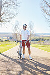 Fitness, bicycle or happy man ready for cycling for training workout and exercise outdoors alone. Start, smile or healthy male sports athlete riding a bike on a road or path for freedom or wellness