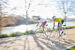 Bicycle race, men and street with motion blur, speed or sports for fitness, countryside and summer. People, fast cycling or friends with training partnership, workout or exercise on journey in nature
