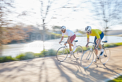 Buy stock photo Bicycle race, men and street with motion blur, speed or sports for fitness, countryside and summer. People, fast cycling or friends with training partnership, workout or exercise on journey in nature