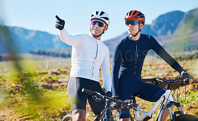 Buy stock photo Exercise, bike and pointing with friends in nature for cycling, taking a break from a cardio or endurance workout. Fitness, mountain or countryside view with a man cyclist team training for sports