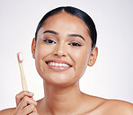 Portrait, smile and woman with a toothbrush, self care and dental hygiene against a white studio background. Face, female person or model with oral hygiene, toothpaste or cleaning mouth with wellness