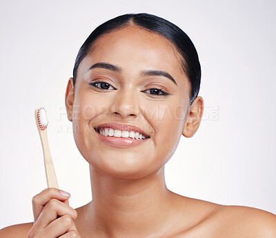 Buy stock photo Portrait, smile and woman with a toothbrush, self care and dental hygiene against a white studio background. Face, female person or model with oral hygiene, toothpaste or cleaning mouth with wellness