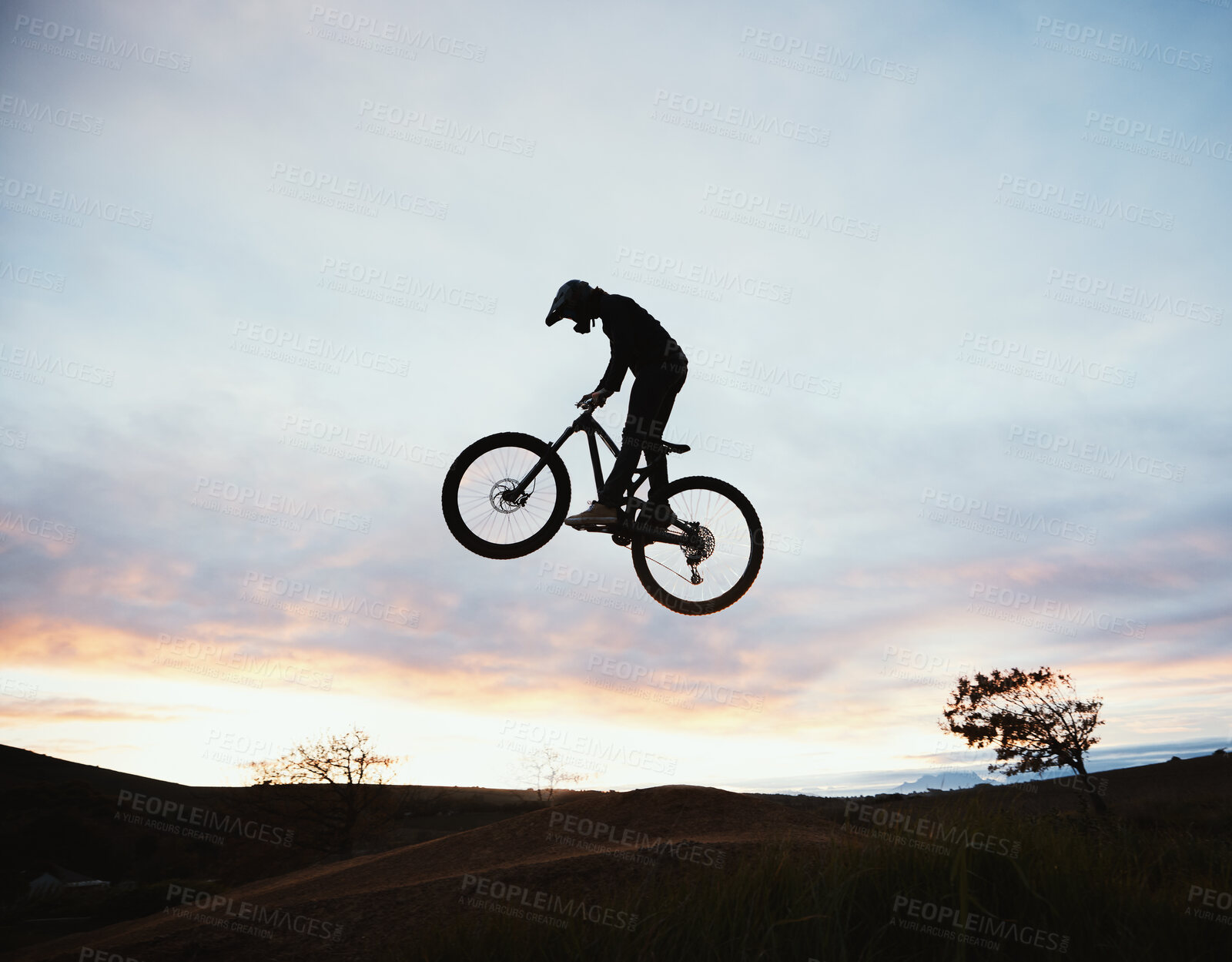Buy stock photo Jump, motorcycle and sunset with sport or sky and adventure in nature with risk or speed. Freedom, action and hill with silhouette with dirt bike in outdoor with training or race or power, danger.