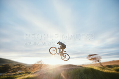 Buy stock photo Fitness, cycling and person with bicycle jump for extreme sports and energy on blur mockup space . Action, bike and cyclist athlete in the countryside with speed, trick and skill, adventure or power