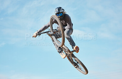 Buy stock photo Extreme sports, bike jump and cyclist cycling a bicycle for  competition stunt routine or training speed in mockup space. Skill, contest and athlete workout or practice sky or air trick for fitness