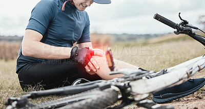 Buy stock photo Injury, accident and a man with knee pain and a bike in nature after cycling or travel for fitness. Sports, cardio inflammation and a biker with a medical emergency on a bicycle in the countryside