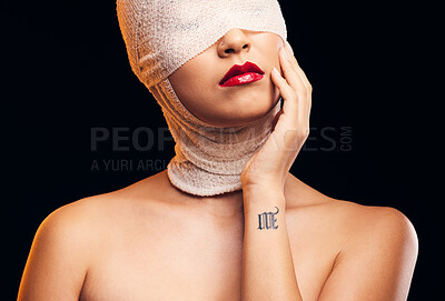 Buy stock photo Bandage, plastic surgery and a woman with cosmetics on a dark background for a medical procedure. Beauty, healing and a girl or model after botox or facial change isolated on a studio backdrop