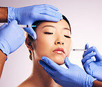 Skincare, injection and Asian woman with plastic surgery, blue gloves or smooth skin against a white studio background. Japanese, female person or model with needles, cosmetic treatment and face care