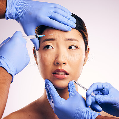 Buy stock photo Woman, needle and worry on face in studio for surgery, stress and thinking for cosmetic results by background. Japanese model, girl and syringe for lip filler, anxiety or transformation for aesthetic