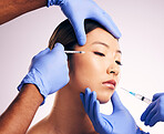 Woman, needle and hands on face in studio for surgery, change and collagen for cosmetic results by background. Japanese model, girl and syringe for lip filler, doctors or transformation for aesthetic