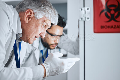Buy stock photo Senior scientist, team and pointing in lab for analysis, experiment results and partnership for virus growth. Science men, teamwork and study for medical research with hazardous bacteria in hospital