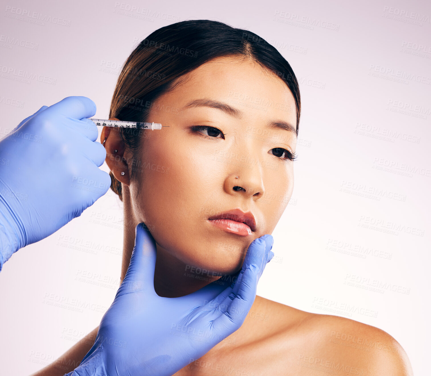 Buy stock photo Asian woman, beauty and needle for surgery in studio for cosmetics, eye filler or collagen by white background. Hands, doctor and syringe for patient, transformation or change with collagen in face