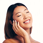 Skincare, wellness and face of happy Asian woman on a white background for beauty, spa and cosmetics. Dermatology, salon mockup and female person with natural skin, satisfaction and facial in studio