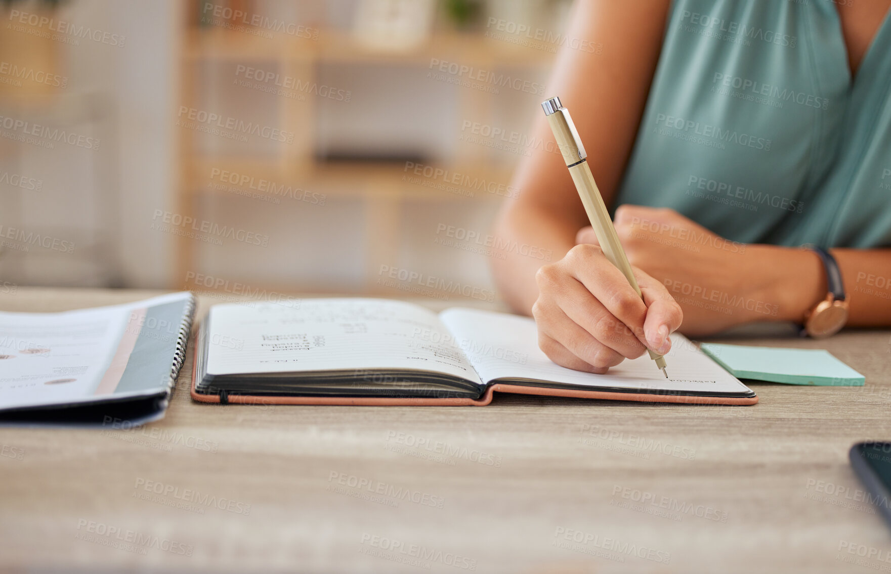 Buy stock photo Hand, pen and writing in a notebook with a business woman sitting at a desk in her office for planning. Agenda, schedule and appointment with a female employee making a note in her journal or diary