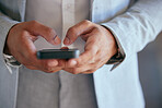 Business man, hands and typing with a phone for communication, email or social network. Closeup of male entrepreneur with a smartphone for message, research or media search with internet connection