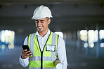 Architecture, phone and happy man with blueprint, reading email or social media at construction site in communication. Engineer with cellphone, typing message with safety and planning with smile.